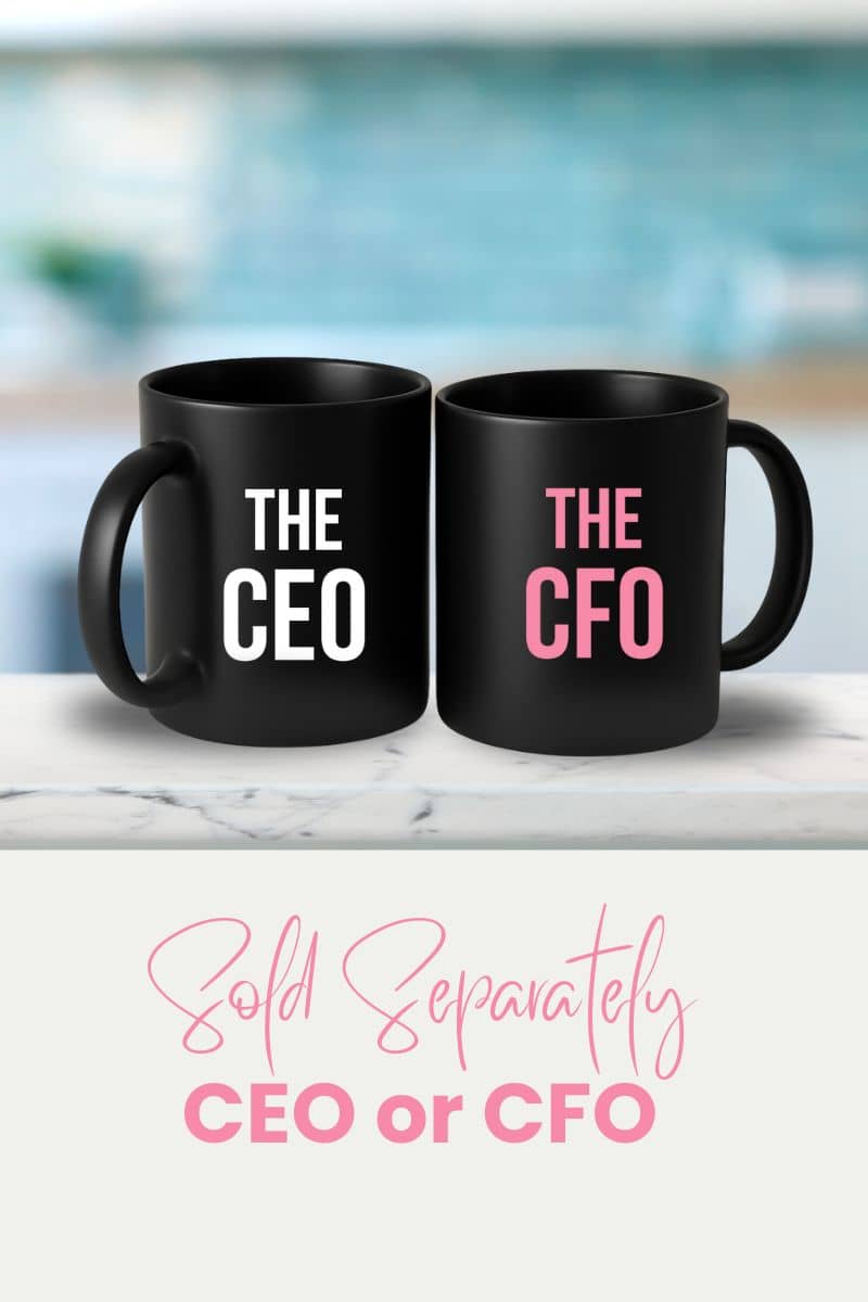 Couple coffee mug with two black mugs labeled 'The CEO' and 'The CFO' on a marble surface with a blurred background.