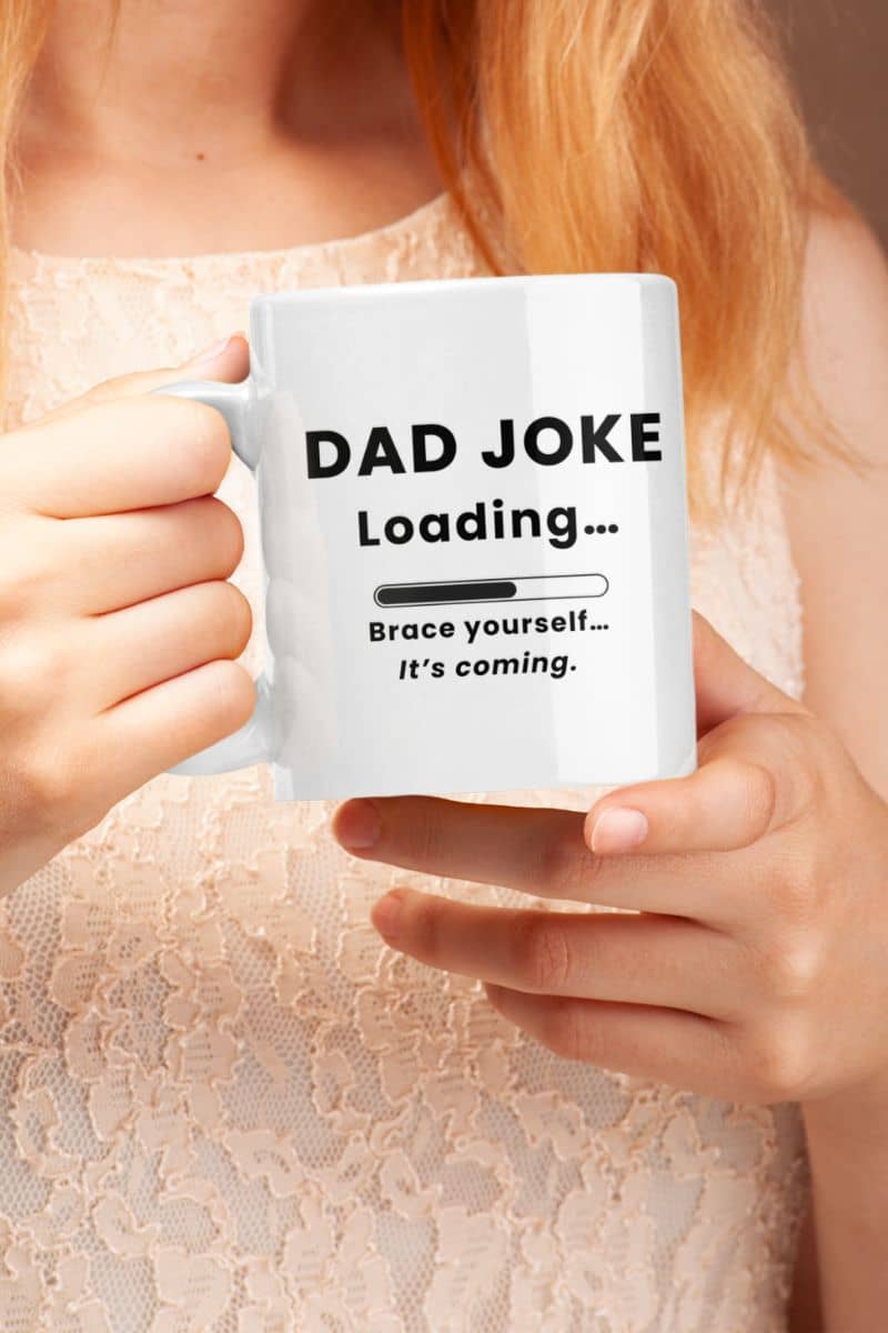 Dad joke mug with a person holding a mug with text 'Dad Joke Loading, Brace yourself…It’s coming.' 