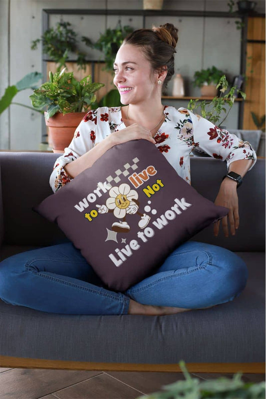 Decorative quote pillow with a woman sitting on the sofa hugging a large pillow with a bright smile