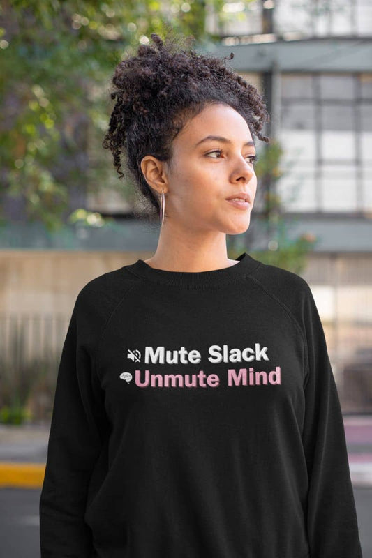 Digital detox sweatshirt with a person wearing a black sweatshirt with text 'Mute Slack Unmute Mind' in an outdoor setting.