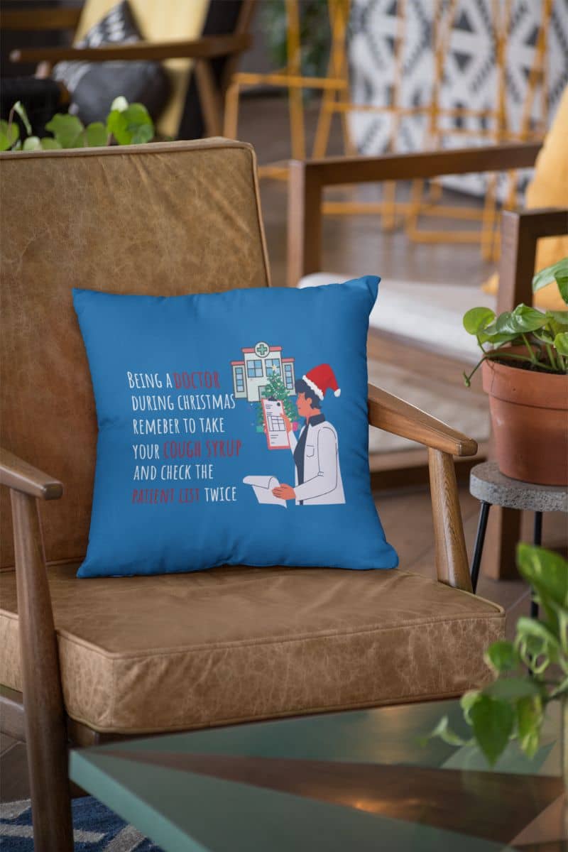 Doctor's christmas humor pillow with a square pillow lying on the sofa