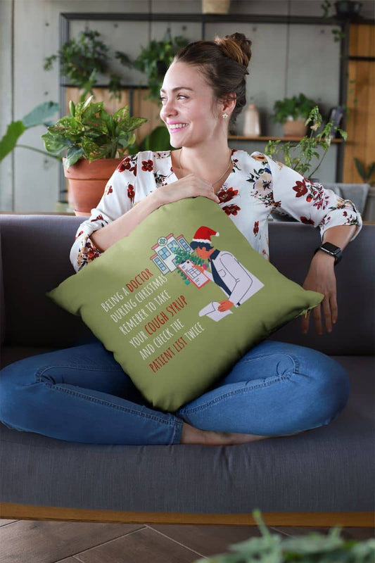 Doctor's christmas humor pillow with a girl hugging a pillow and sitting on the sofa with a bright smile
