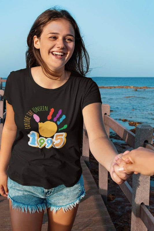 Explore the unseen t-shirt with a girl smiling brightly while holding her boyfriend's hand on the bridge