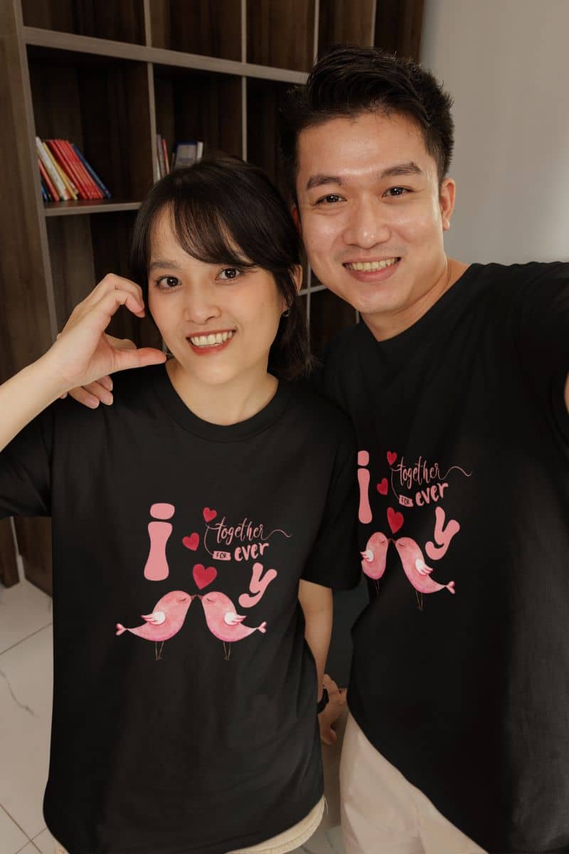 Forever love birds t-shirt with a couple taking a selfie with bright smiles