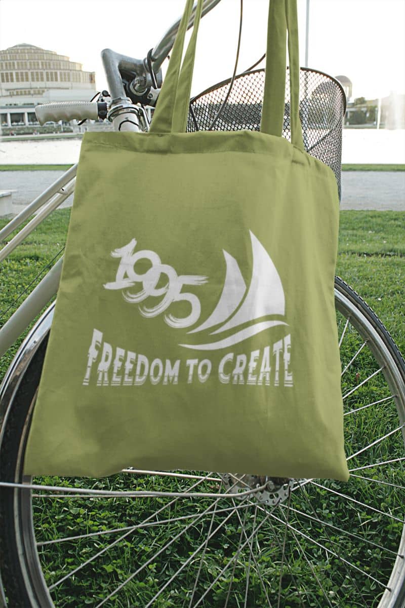 Freedom to Create Tote Bag with tote bag on bike