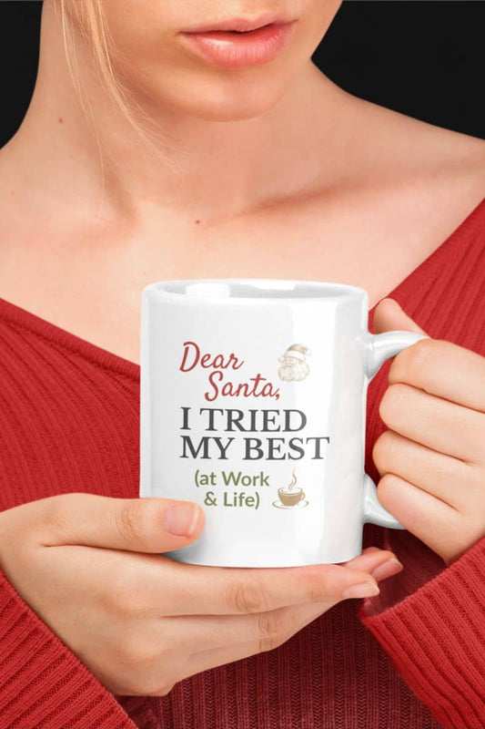 Funny Holiday coffee mug with a person holding a white mug with humorous text  'Dear Santa, I tried my best (at work & life)'