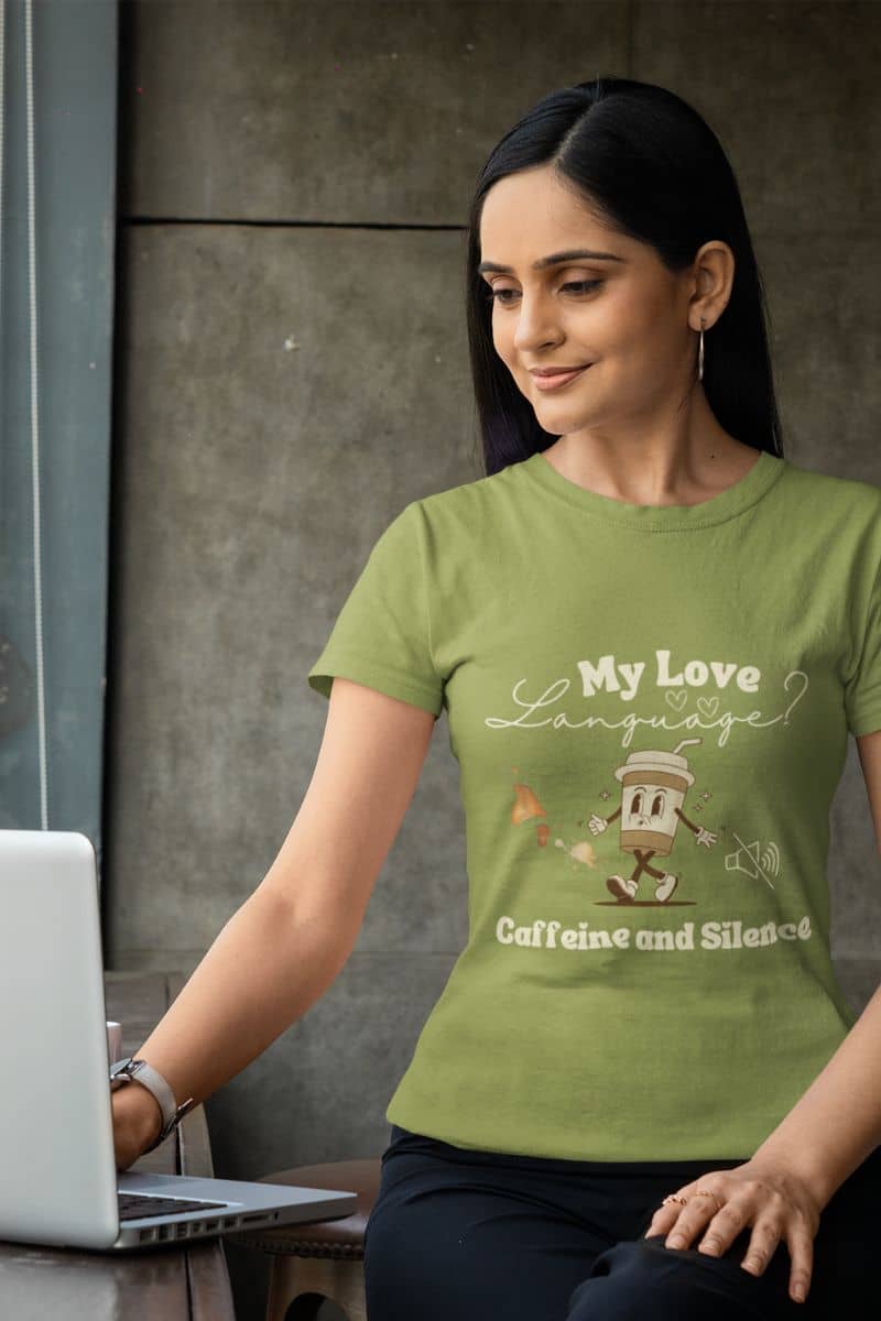 Funny coffee lover t-shirt with a girl sitting working on a laptop by the window