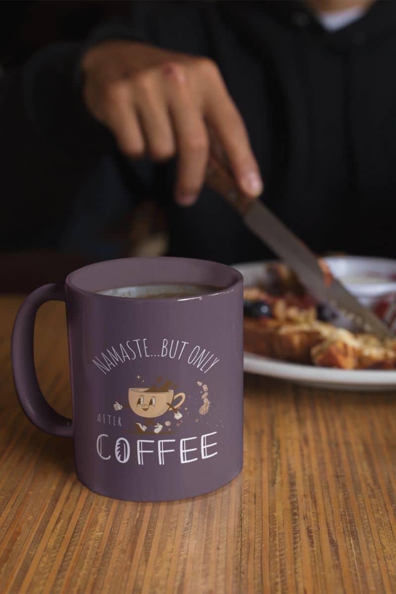 Funny mindful coffee mug with a person having breakfast next to a cup of coffee