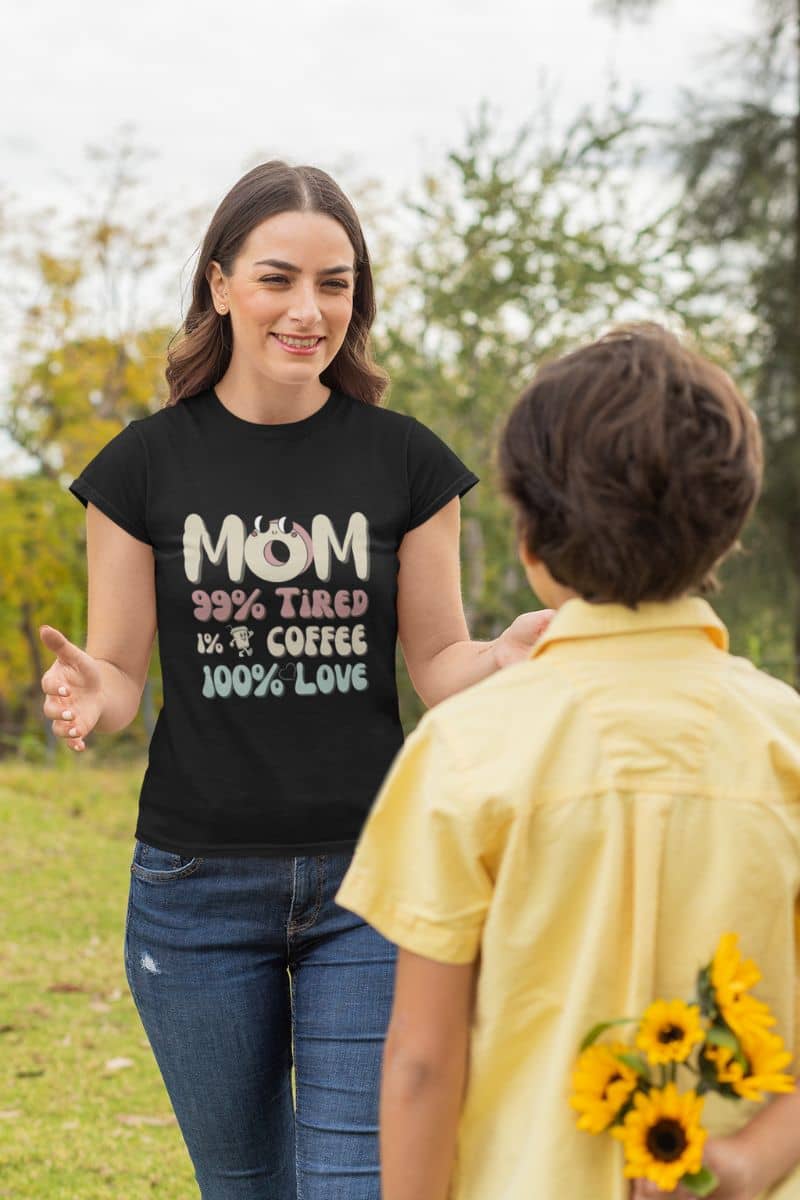 Funny mom t-shirt with a boy hiding flowers behind his back to give to his mother