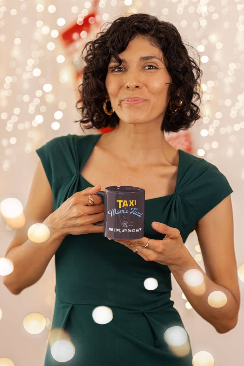 Funny mom's taxi coffee mug with a middle-aged woman holding a cup of coffee in the party