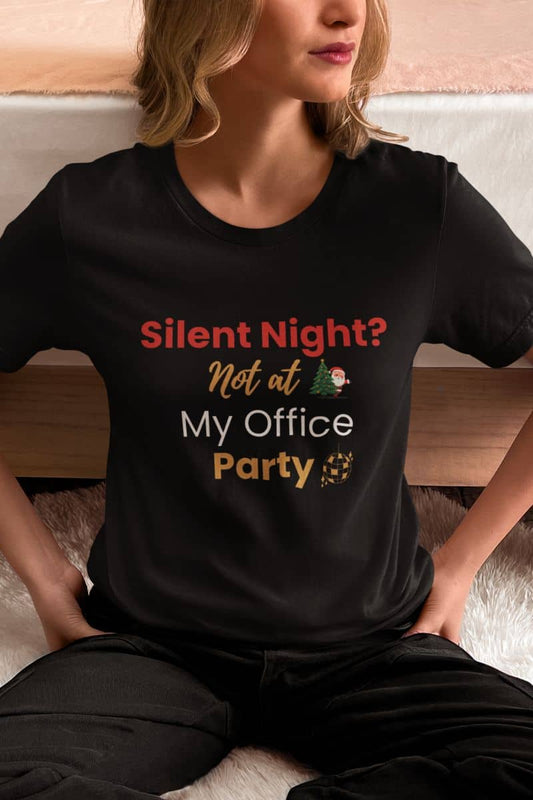 Funny office Christmas shirt with a person wearing a black t-shirt with humorous text 'Silent Night? Not at My Office Party'