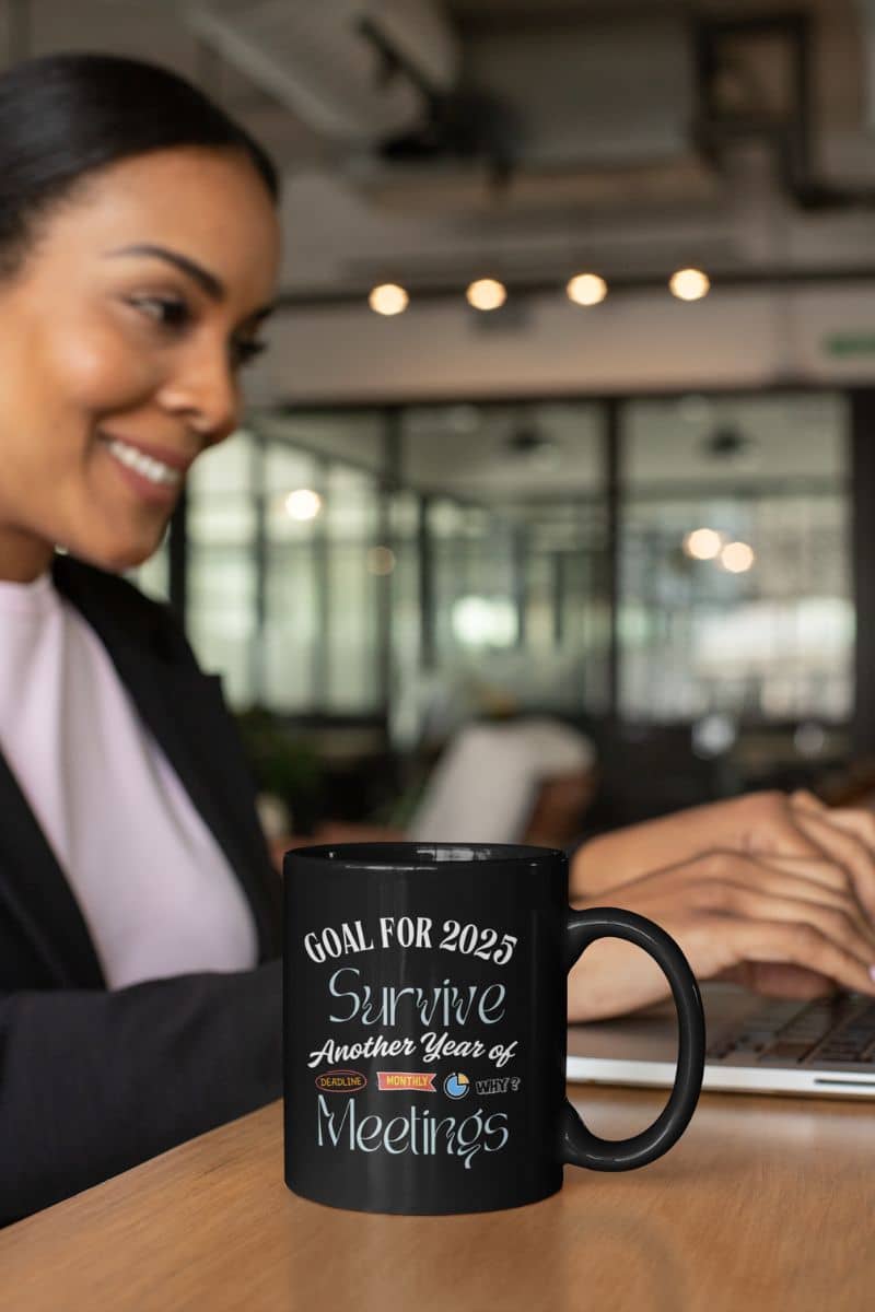 Funny office coffee mug with a woman sitting working in the office next to a cup of coffee