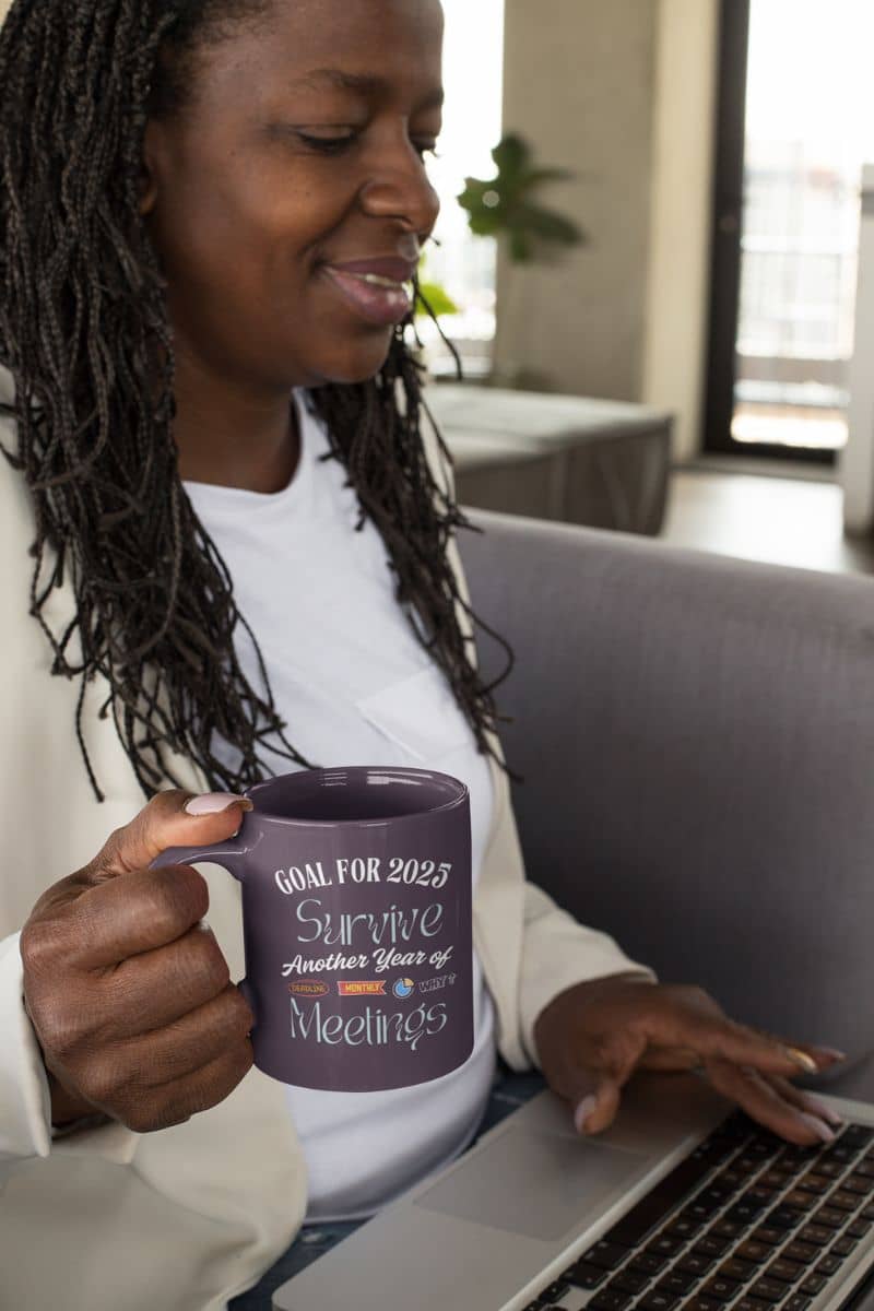 Funny office coffee mug with a woman holding a cup of coffee and working on a laptop