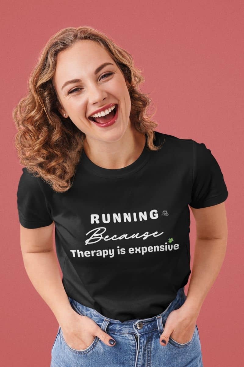 Funny running t-shirt with a woman wearing a t-shirt with text 'Running because therapy is expensive'