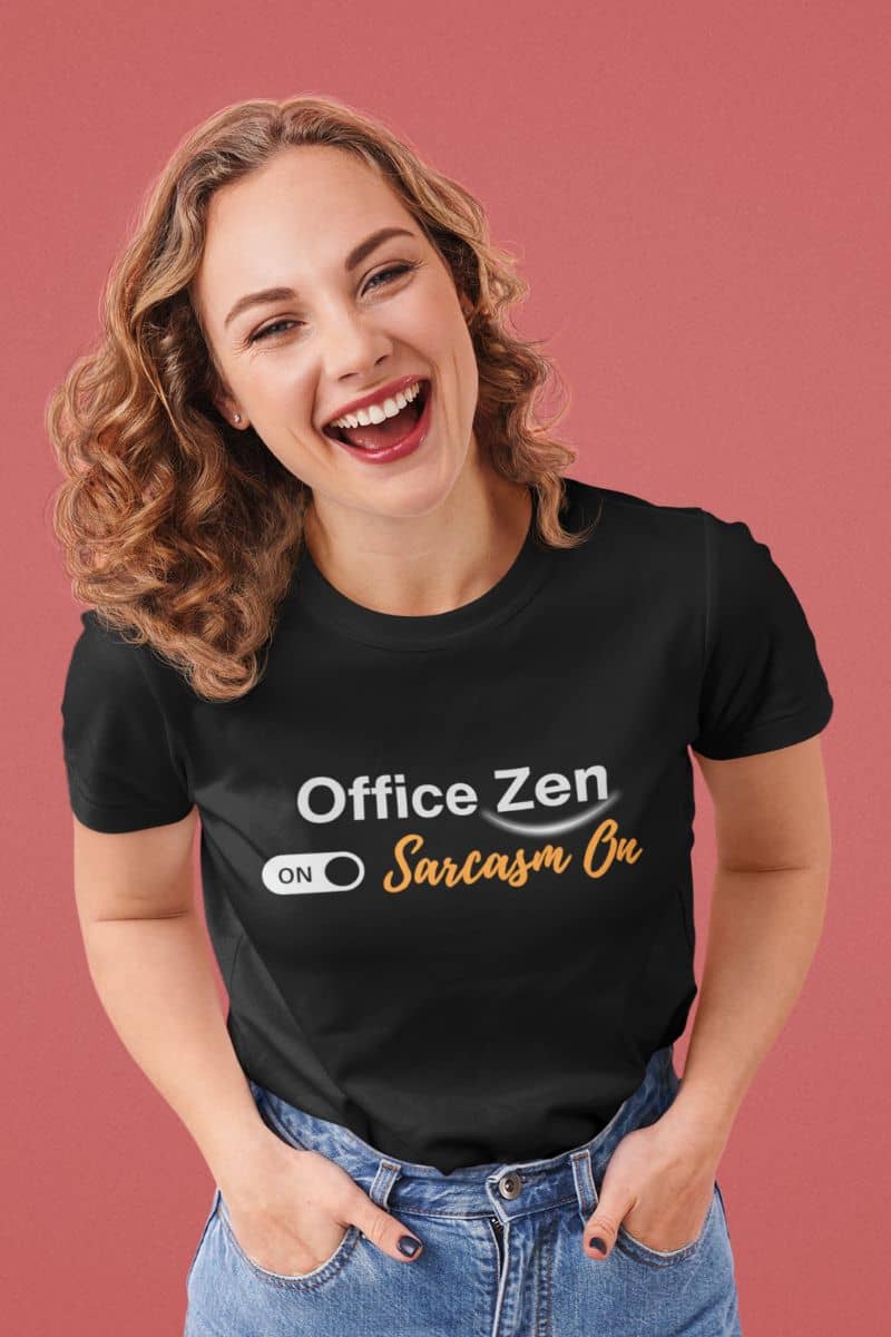 Funny zen t-shirt with a woman wearing a black t-shirt with 'Office Zen ON Sarcasm ON' text on a pink background