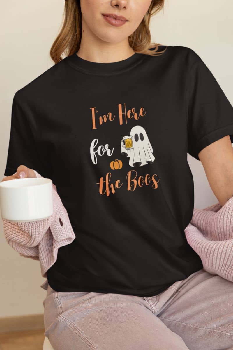 Ghost costume shirt with a girl wearing a T-shirt that says “I’m Here for the Boos.”