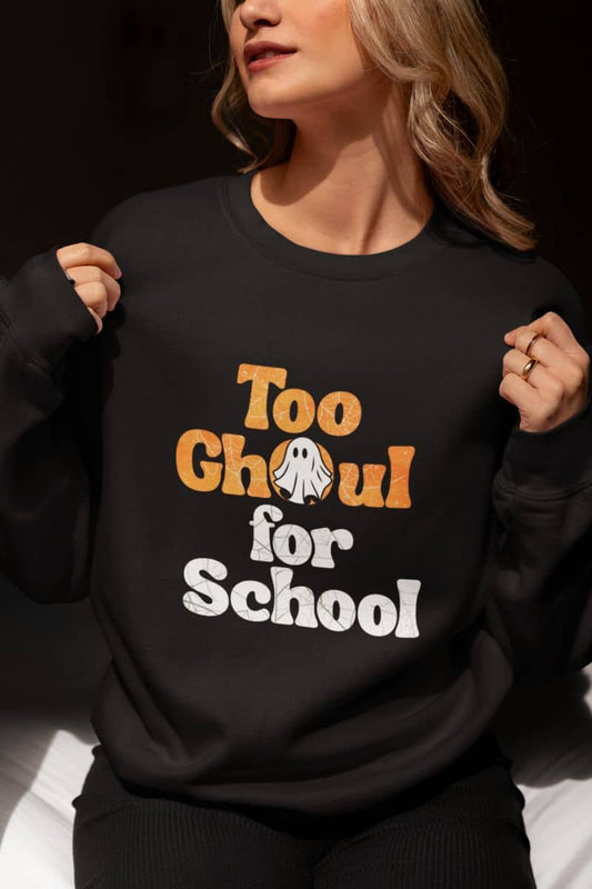 Ghost sweatshirt with a person wearing a black sweatshirt with 'Too Ghoul for School' text and ghost graphic.