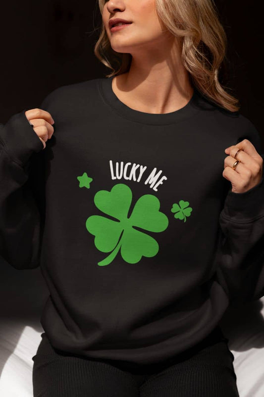 Good luck graphic sweatshirt with a person wearing a black sweatshirt with a green four-leaf clover and 'Lucky Me' text.