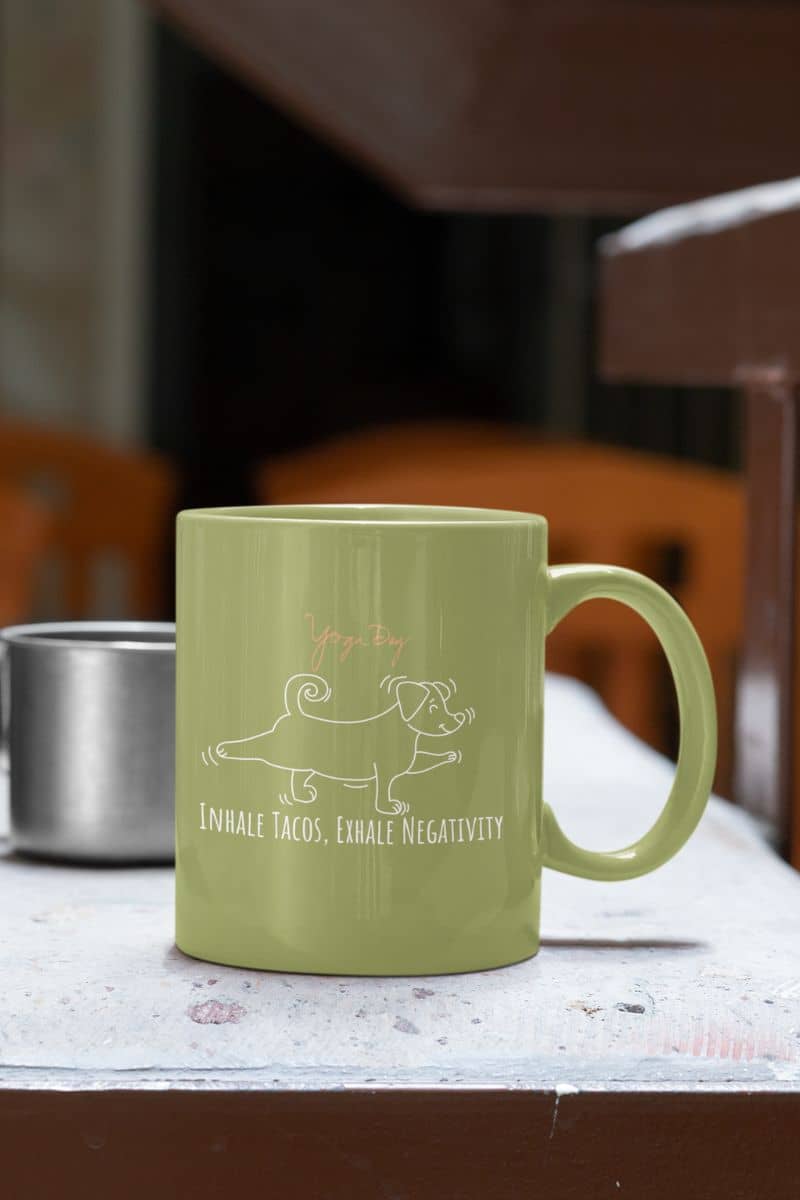 Inhale tacos, exhale negativity yoga mug with a cup on the stone table