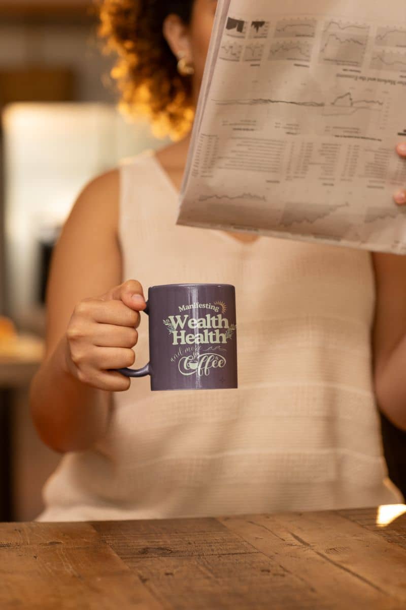 Inspirational coffee mug with a woman reading a document while holding a cup of coffee in her hand