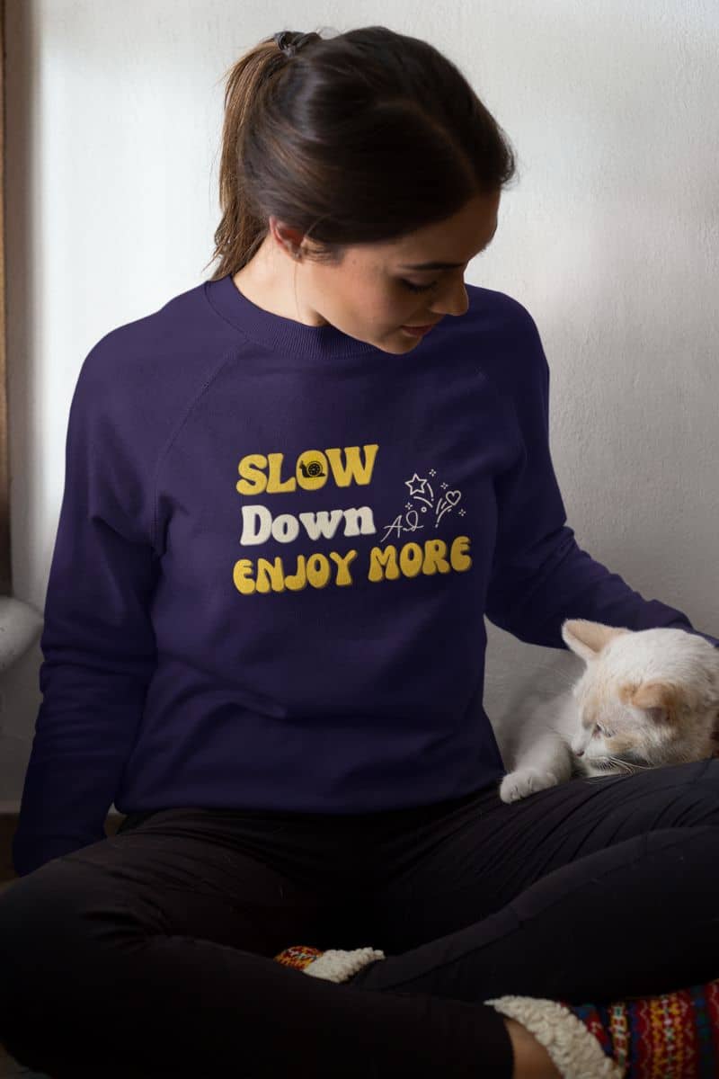 Inspirational pullover sweatshirt with a girl playing with her cat