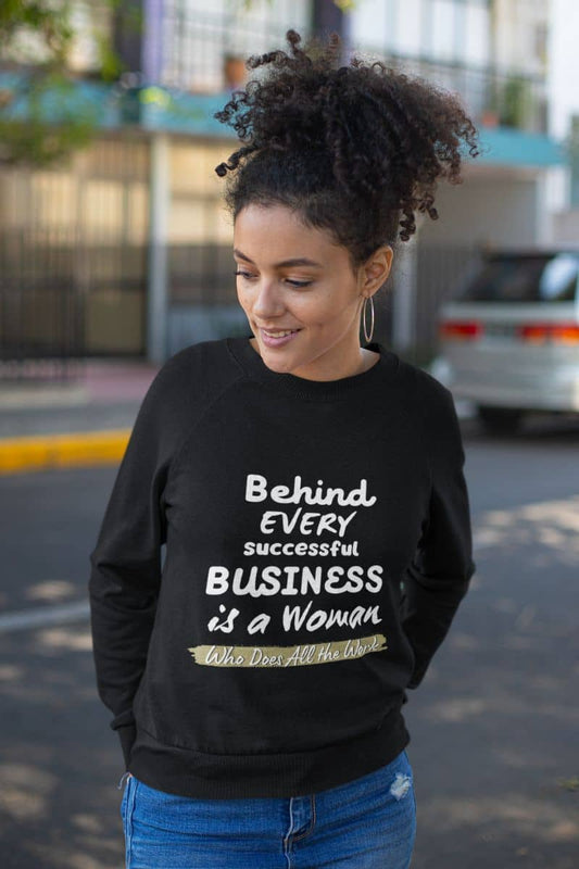Inspirational sweatshirts with a curly haired woman standing with her hands behind her back and looking to one side