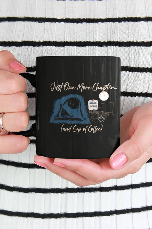 Just one more chapter coffee mug with a girl in a striped t-shirt holding a cup of coffee in front of her chest