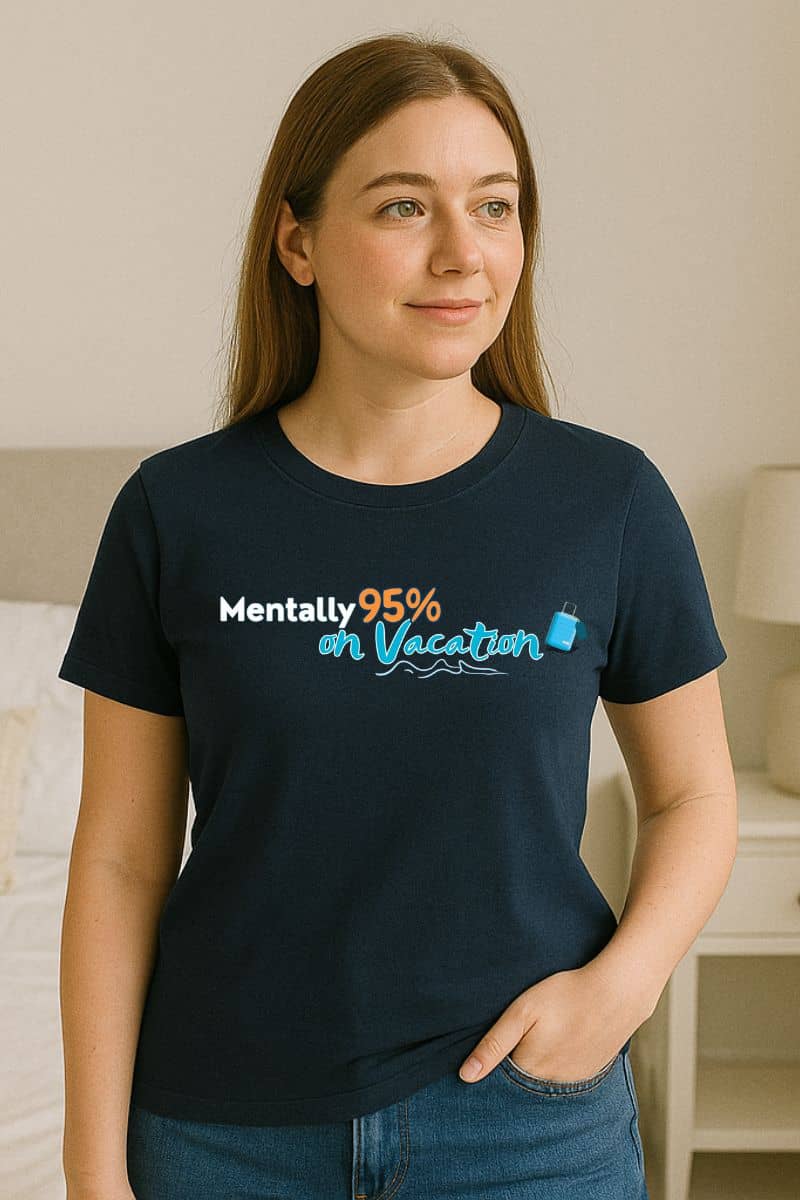 Lazy day graphic tee with a woman wearing a black t-shirt with text 'Mentally 95% on Vacation' in a room.