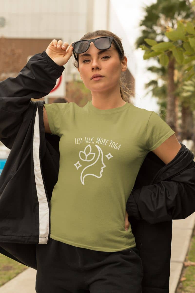 Less talk, more yoga t-shirt with the girl posing by pushing her glasses up on her forehead and unzipping her jacket to the back