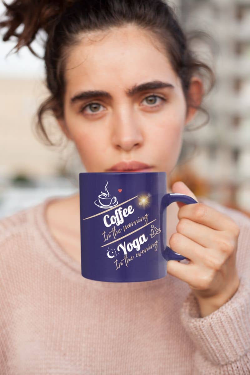 Lifestyle mug with the girl with messy hair holding a cup of coffee in front of her