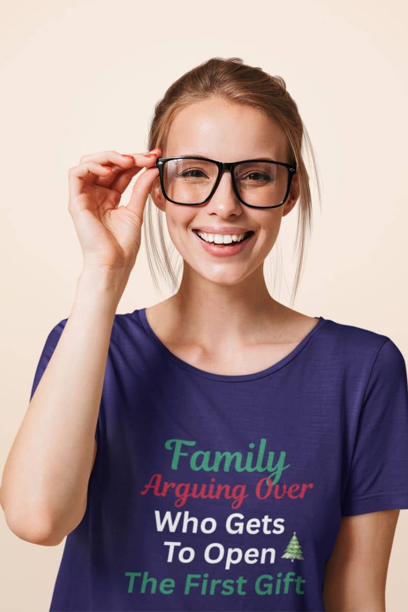Matching family Christmas shirt with a person wearing a purple t-shirt with humorous text on a beige background