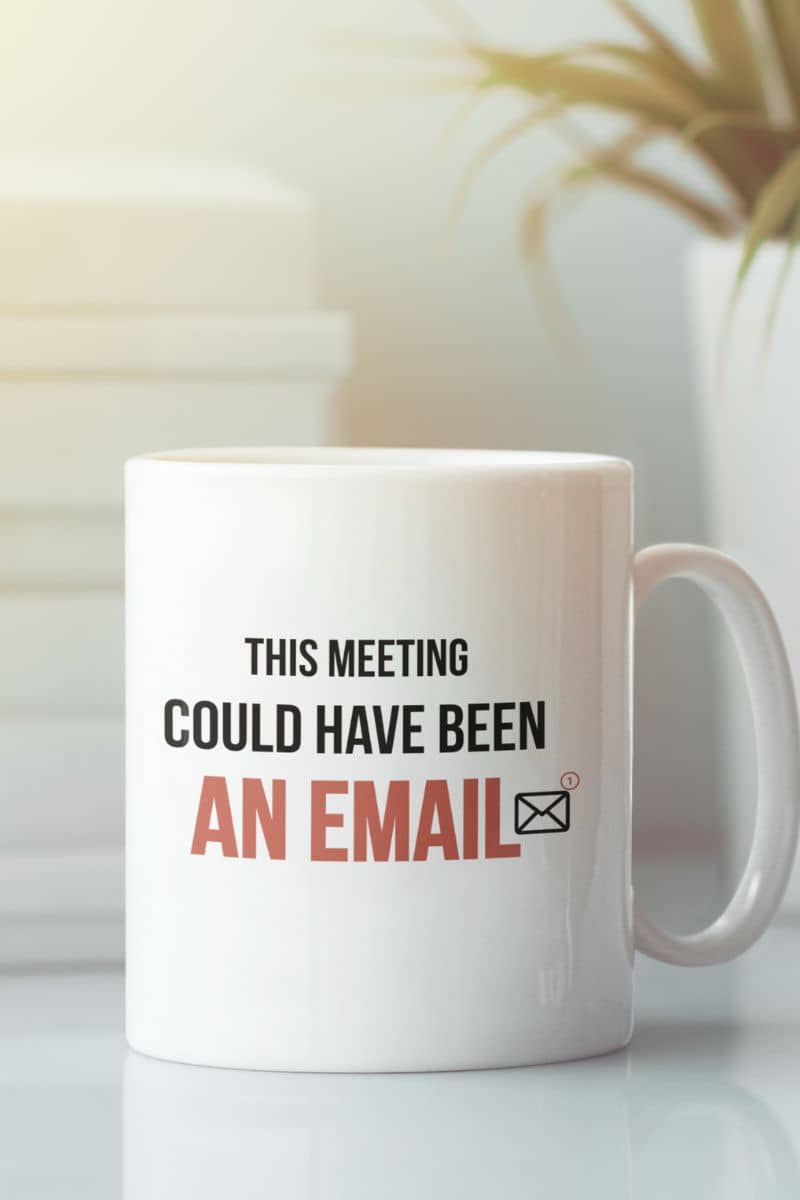 Meeting coffee mug with a white mug with text 'This meeting could have been an email' on a blurred background