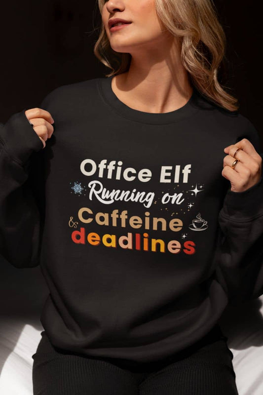 Office Elf sweatshirt with a person wearing a black sweatshirt with 'Office Elf Running on Caffeine & Deadlines' text.
