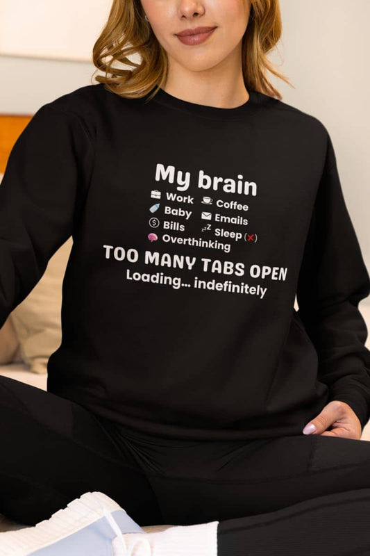 Overstimulated sweatshirt with a woman wearing a sweatshirt featuring the text 'My Brain Has Too Many Tabs Open'