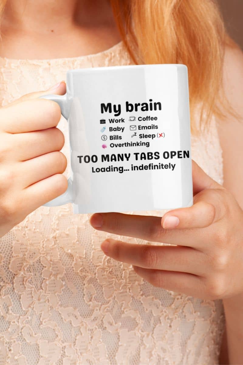 Overthinking coffee mug with a person holding a mug featuring the text 'My Brain Has Too Many Tabs Open. Loading… indefinitely.'