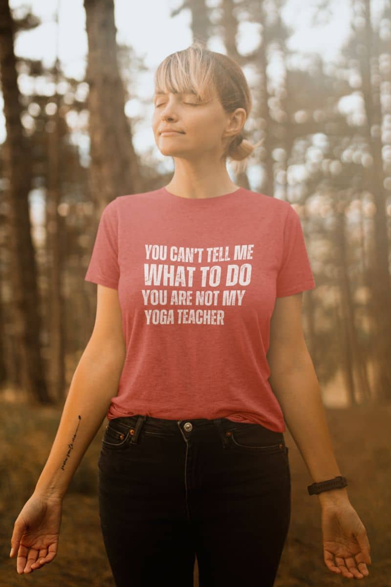 Playful yoga T-shirt with a girl standing breathing fresh air in the forest