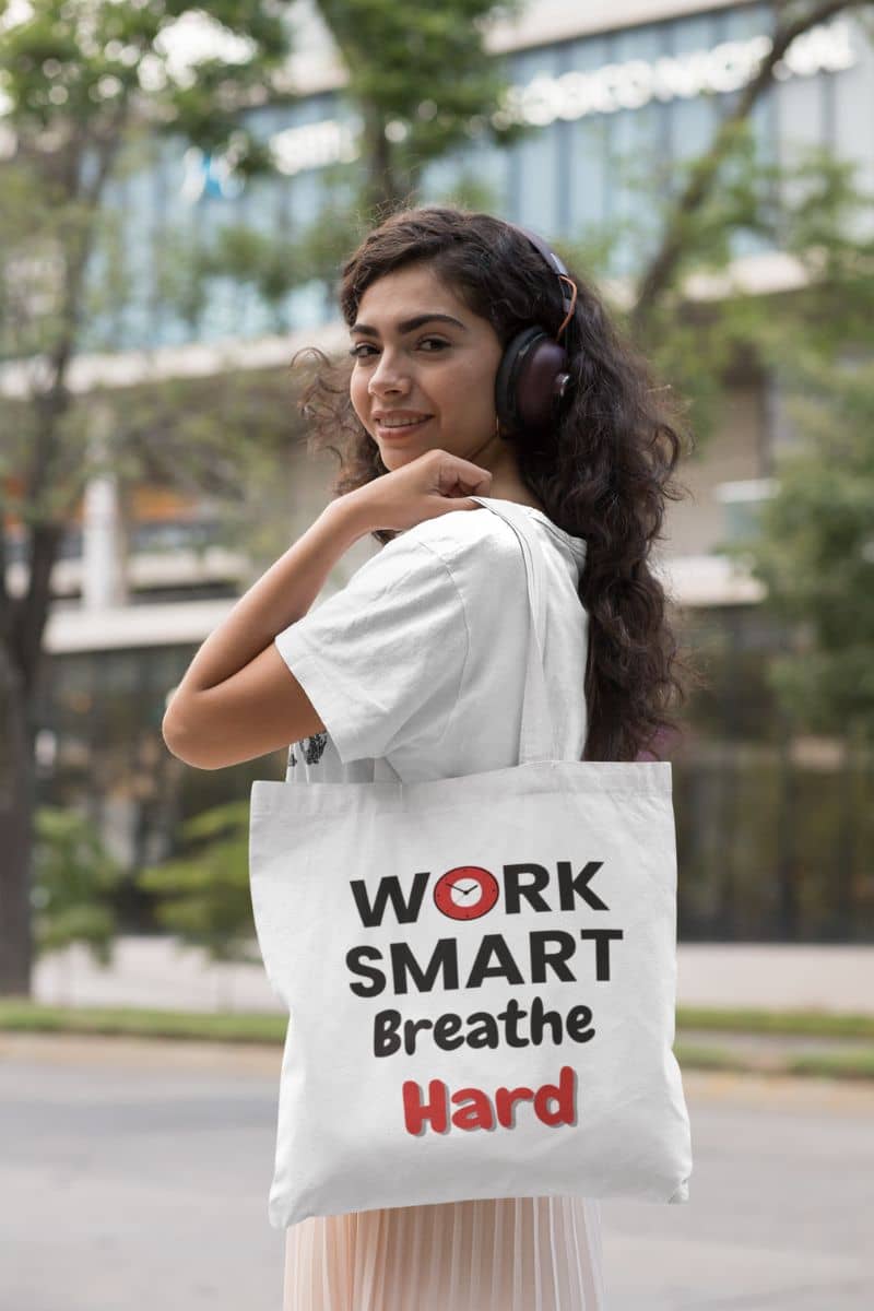 Positive quote office tote with a woman holding a tote bag with motivational text in an outdoor setting