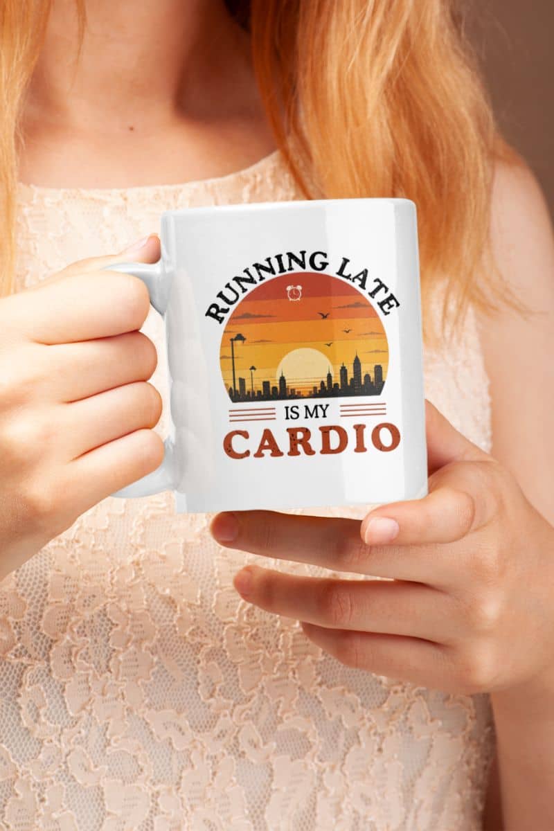 Procrastination mug with a person holding a mug with 'Running late is my cardio' design