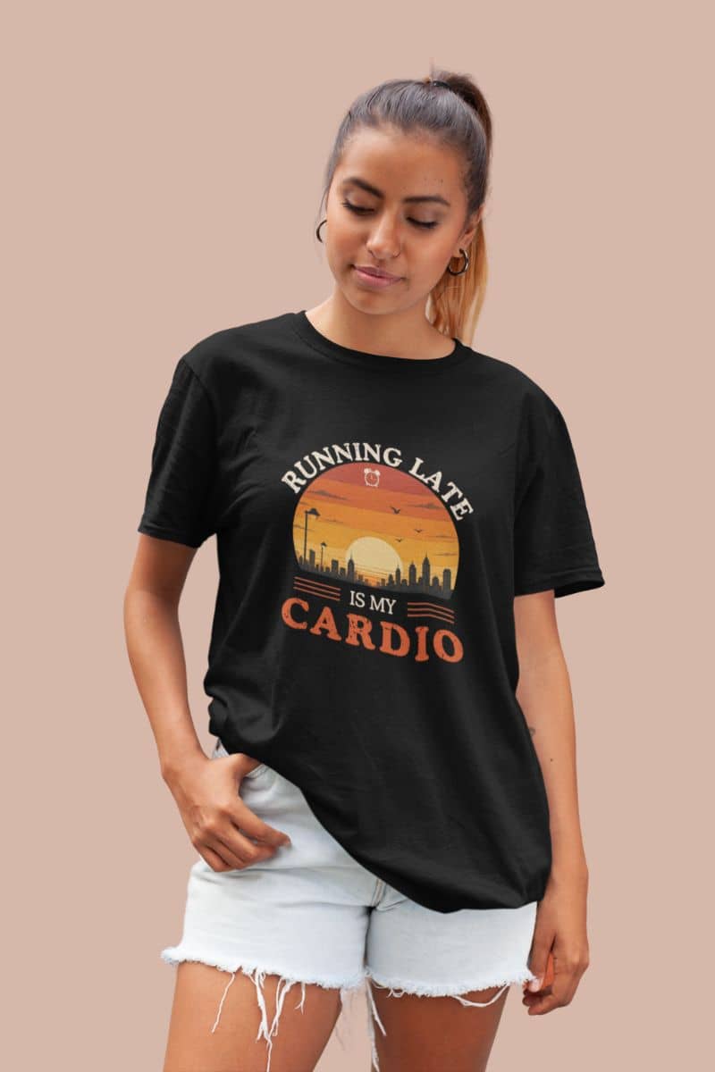 Procrastinator shirt with a woman wearing a black t-shirt with text 'Running Late Is My Cardio' on a beige background