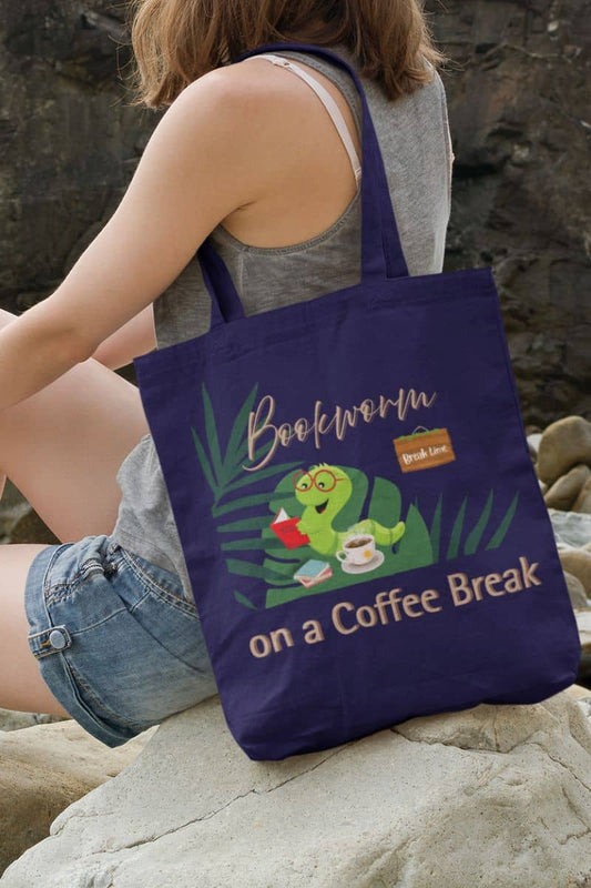 Reading break tote bag with a girl sitting on a rock watching the sea