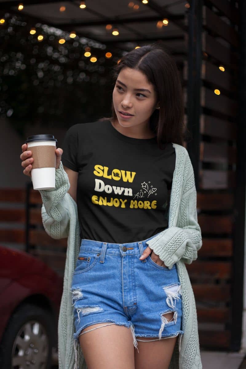Relaxed fit graphic tee with a girl posing with a cup of coffee in her hand