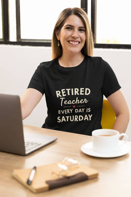 Retired teacher shirt with a woman wearing a black t-shirt that reads 'Retired Teacher — Every Day Is Saturday' 