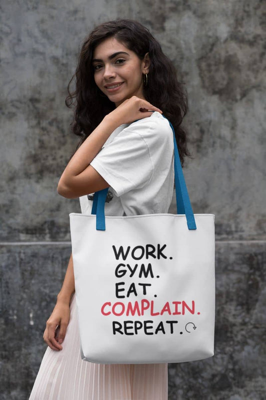 Reusable canvas tote bag with a woman holding a tote bag with text against a textured wall.