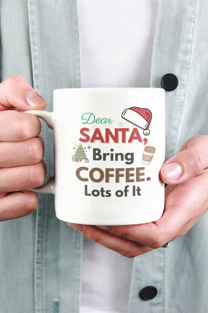 Santa quote mug with a person holding a mug with text 'Dear Santa, Bring Coffee. Lots of It.'