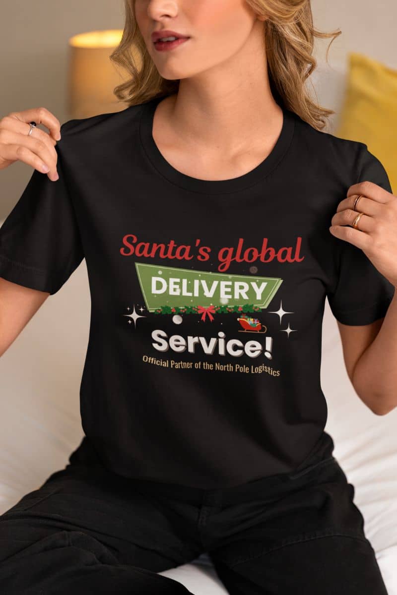 Santa shirt with a person wearing a black t-shirt with text 'Santa's Global Delivery Service.' and graphics.