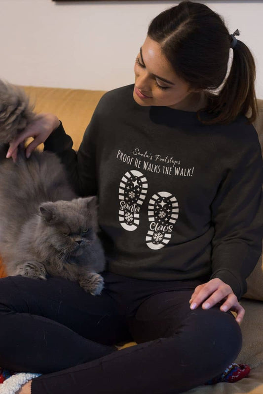 Santa's Footsteps Sweatshirt with the girl playing with her black cat