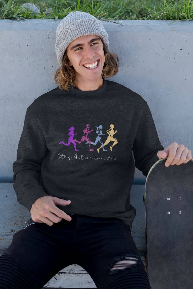 Stay Active in 2025 Sweatshirt with a man holding a skateboard and smiling brightly