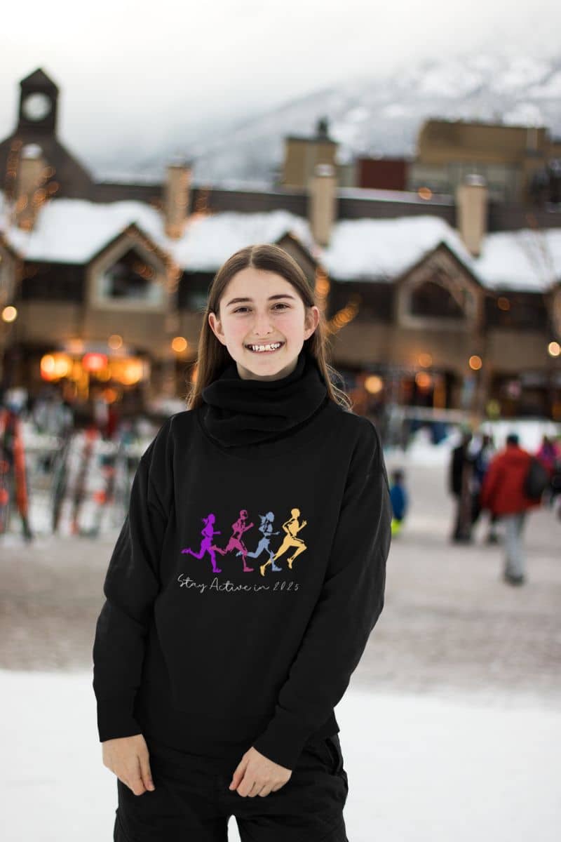 Stay Active in 2025 Sweatshirt with a girl posing with a big smile in front of the shopping mall