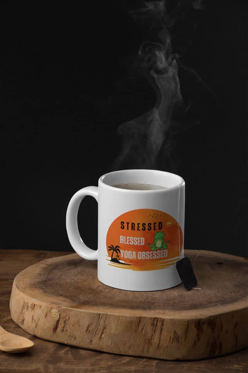 Stressed, blessed, yoga obsessed mug with a hot cup of tea on the cutting board