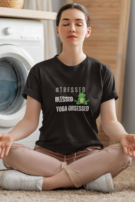 Stressed? blessed, yoga obsessed t-shirt with the girl meditating on the floor while the washing machine is doing the laundry